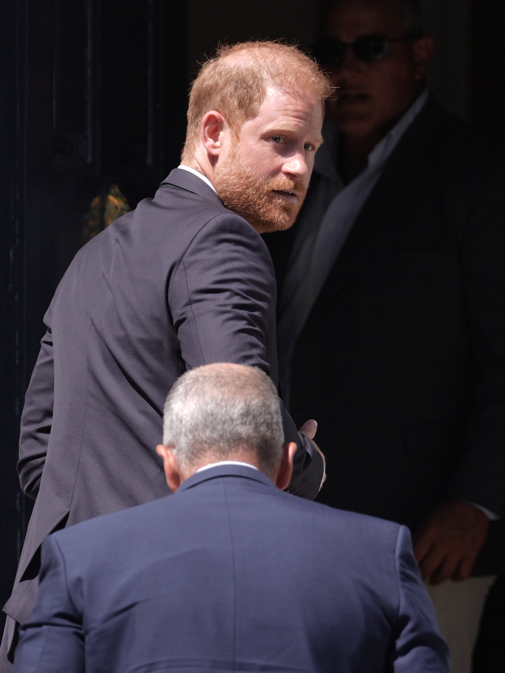 Harry glances at the media as he arrives at Chatham House (Stefan Rousseau/PA) (PA Wire)