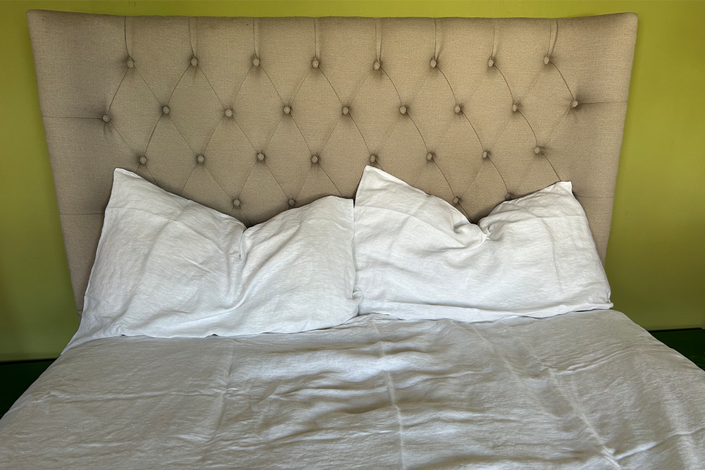 The pure white shade kept the bed looking clean, unfussy and inviting (Ali Howard/The Independent)