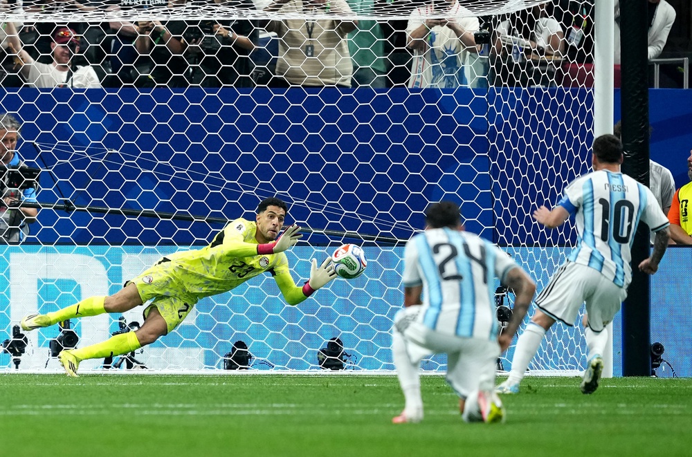 Argentina's Lionel Messi (right) has a penalty saved by Egypt goalkeeper Mohamed Shobeir (PA)