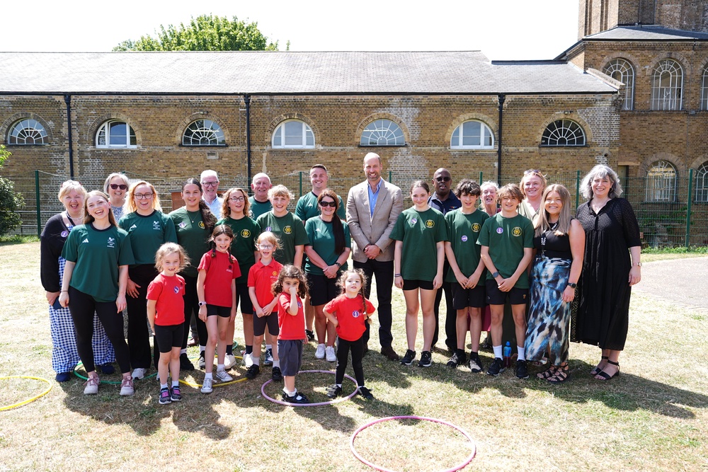 The Prince of Wales with athletes, teachers and pupils during a visit to the Ysgol Gymraeg Llundain (The London Welsh School) in Hanwell, West London (Aaron Chown/PA) (PA Wire)