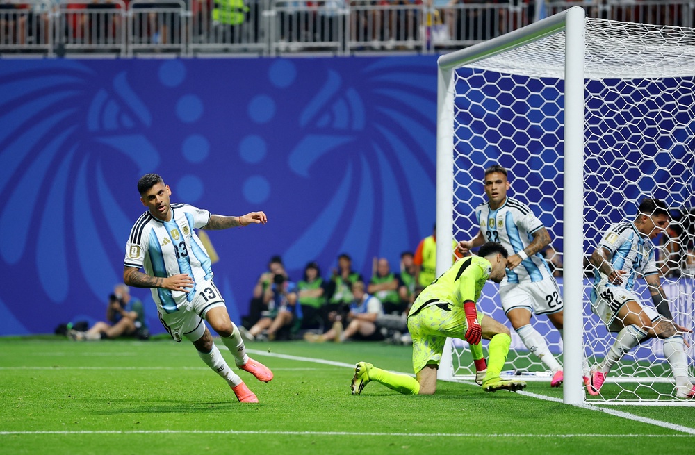 Argentina's Cristian Romero celebrates scoring their first goal (Reuters)