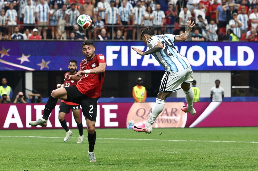 Enzo Fernandez heads home the third for Argentina (Reuters)