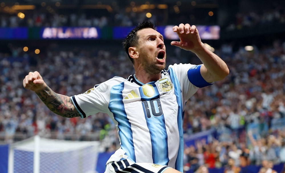 Argentina's Lionel Messi celebrates scoring their second goal (Reuters)