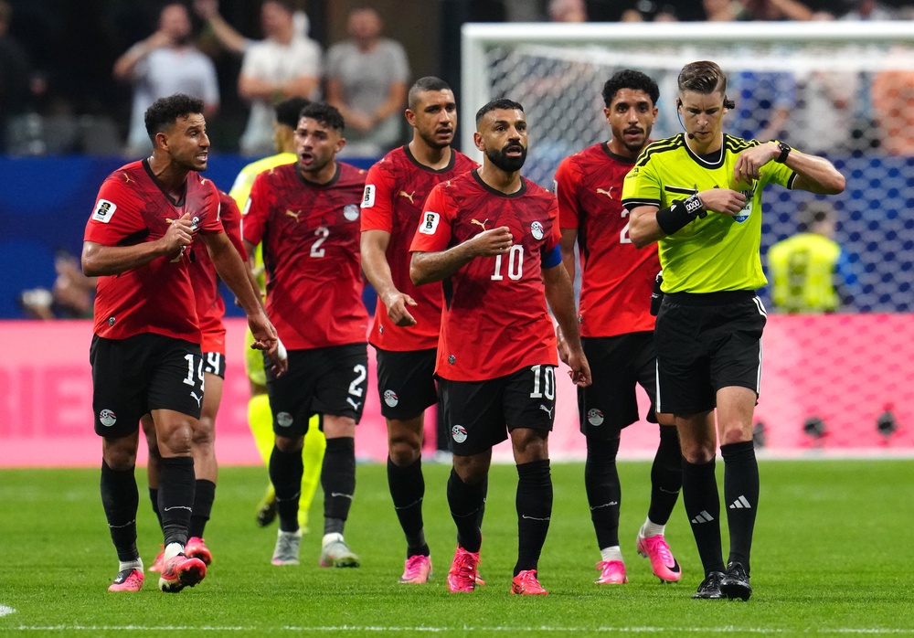 Egypt players appeal to referee Francois Letexier after Argentina's third goal (PA)