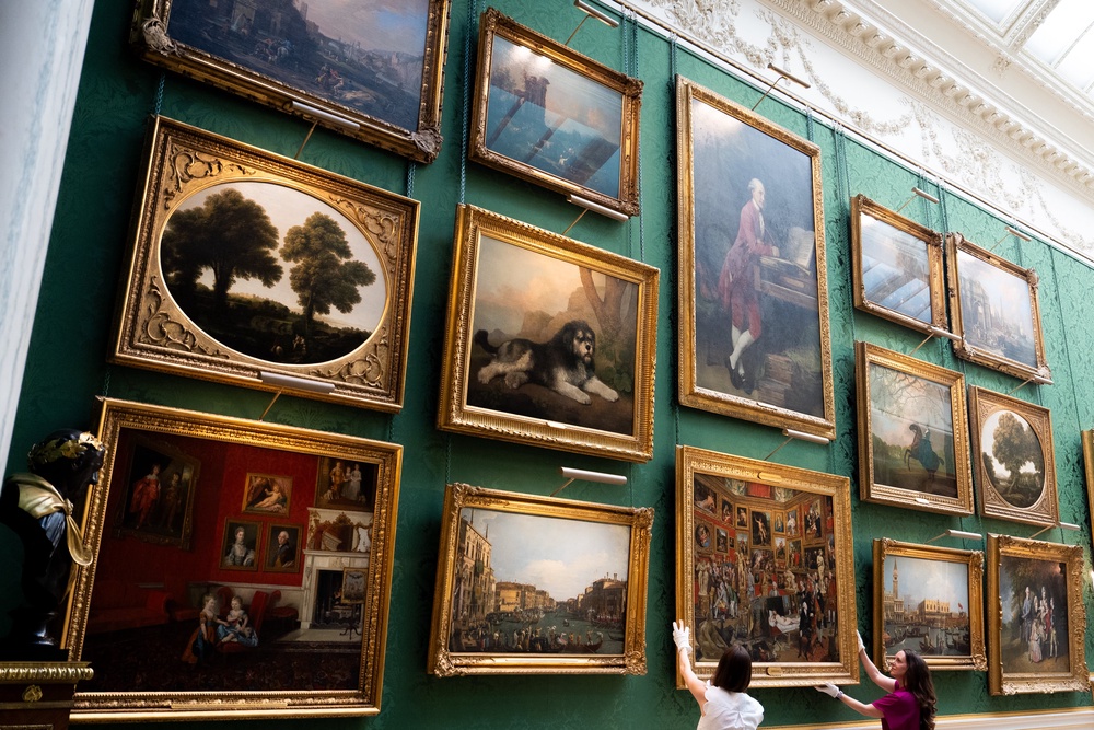 Royal Collection Trust staff adjust Johan Joseph Zoffany’s The Tribuna of the Uffizi in the new display in the Picture Gallery at Buckingham Palace (Aaron Chown/PA) (PA Wire)