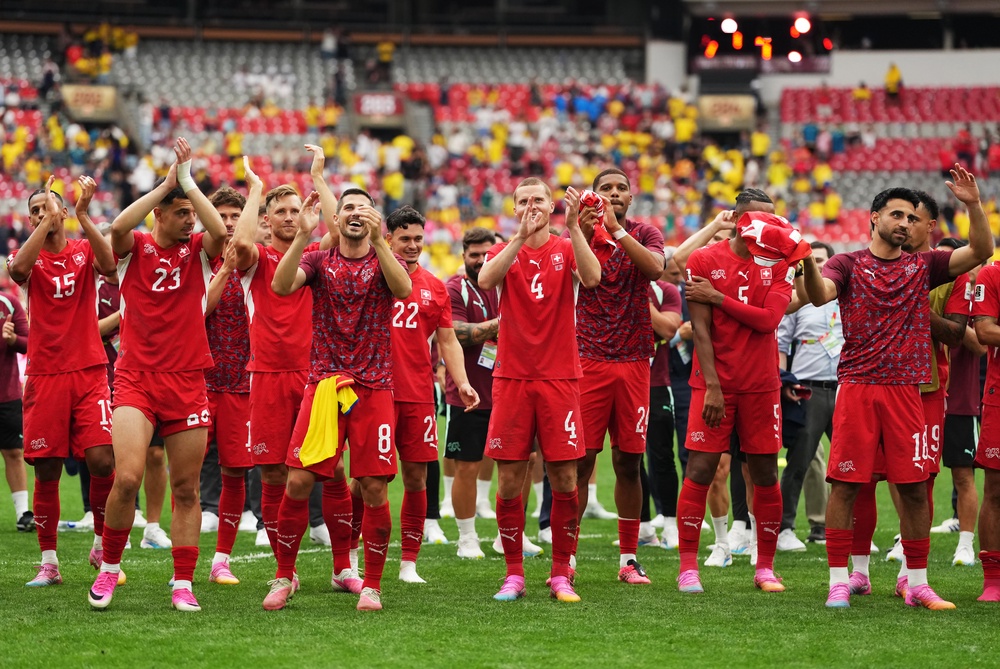 Switzerland players salute supporers after winning in a penalty kick shootout (AP)