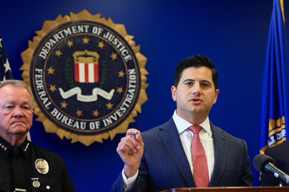Assistant US attorney Bill Essayli speaks as American and Canadian law enforcement officials announce federal charges and arrests of alleged members of a transnational organised crime group in Los Angeles on 7 July 2026 (Reuters)