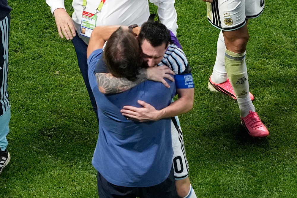 Argentina's coach and captain shared an emotional embrace after their World Cup win over Egypt (AP)