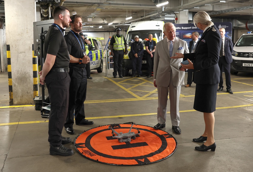 The King speaks with specialist officers from the drone team and Lucy D’Orsi, Chief Constable of British Transport Police, as he officially opens the headquarters of the British Transport Police in central London (Shane Anthony Sinclair/PA) (PA Wire)