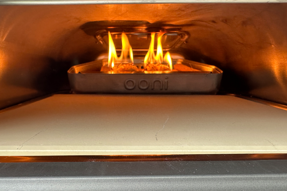 The pizza oven gets up to a maximum temperature of 500C (Rachael Penn/The Independent)