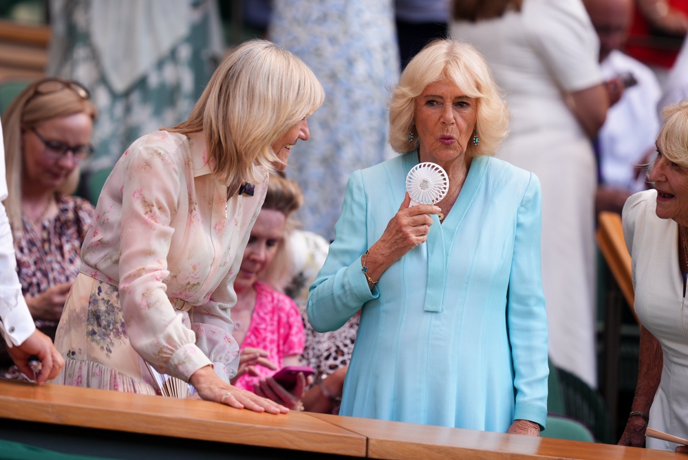 Camilla uses a fan to keep cool in the royal box at Wimbledon (Mike Egerton/PA) (PA Wire)