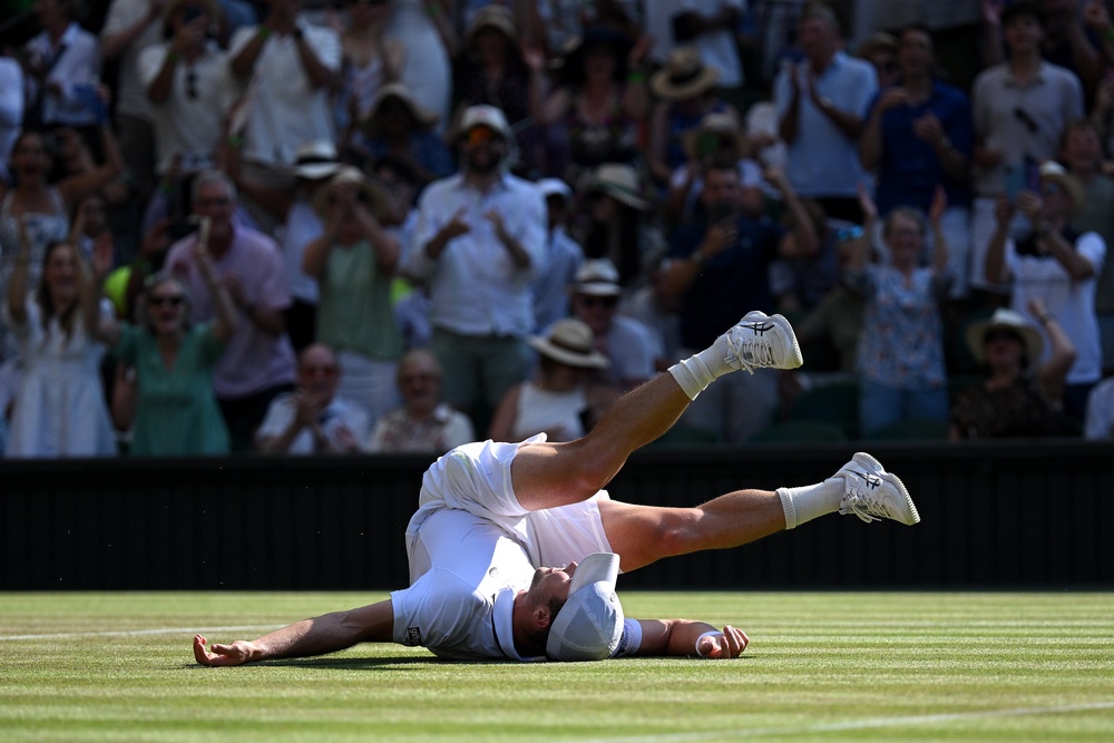 Fery collapsed to the turf in disbelief as he sealed the match with an ace (Getty)