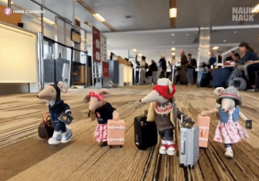 In this still from an AI-generated short made on NaukNauk, Maileg mice, a line of handcrafted Danish miniature stuffed toys, scurry through an airport (NaukNauk)