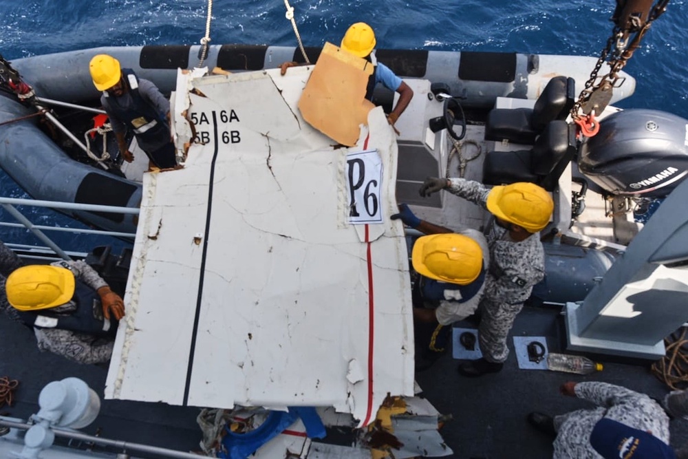 The navy and civilian teams in planes and ships found the plane debris after about 12 hours of searching (Pakistan Navy via AP)