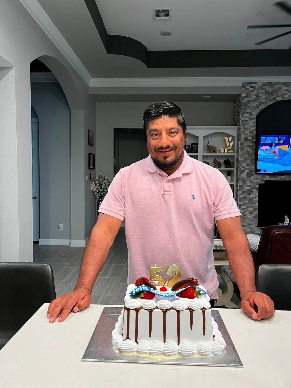 Lorenzo Salgado Araujo, a Mexican motorist who was fatally shot by an ICE agent during a vehicle stop in Houston, stands behind a birthday cake in an unknown location in this picture obtained from social media, released July 8, 2026 (Reuters)