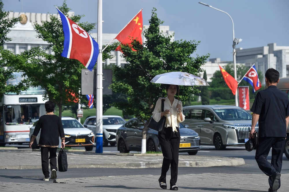 National flags of North Korea and China fly on a street in Pyongyang (AFP/Getty)