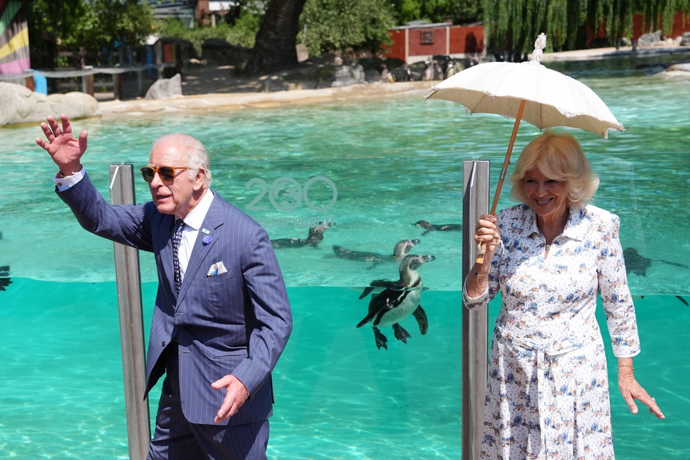 The King and Queen waved to staff members and the public during their visit (Jonathan Brady/PA) (PA Wire)