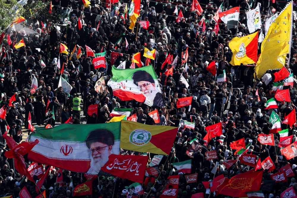 Mourners gather on the day of the burial of Iran's late Supreme Leader Ayatollah Ali Khamenei in his hometown of Mashhad on 9 July (Reuters)