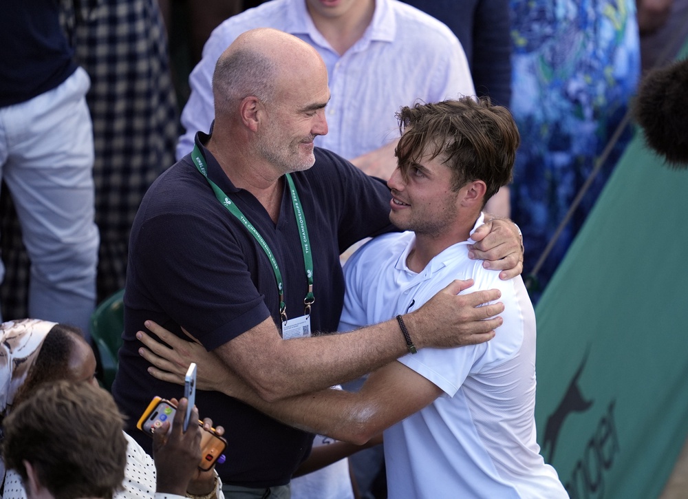 Arthur Fery, right, embraces father Loic (Andrew Matthews/PA) (PA Wire)