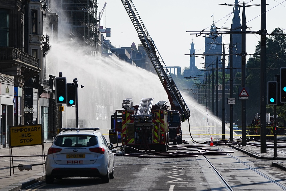 Firefighters at the scene (Jane Barlow/PA) (PA Wire)