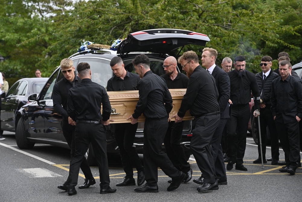 The coffin of Mark McCullagh-Crichton is carried into the Cathedral of Christ the King (Mark Marlow/PA) (PA Wire)