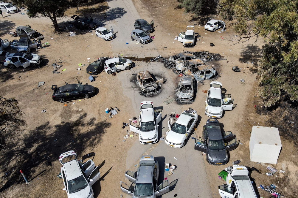 Abandoned vehicles at the site of the 7 October attack on the Nova music festival in the Negev desert in southern Israel. (AFP via Getty Images)