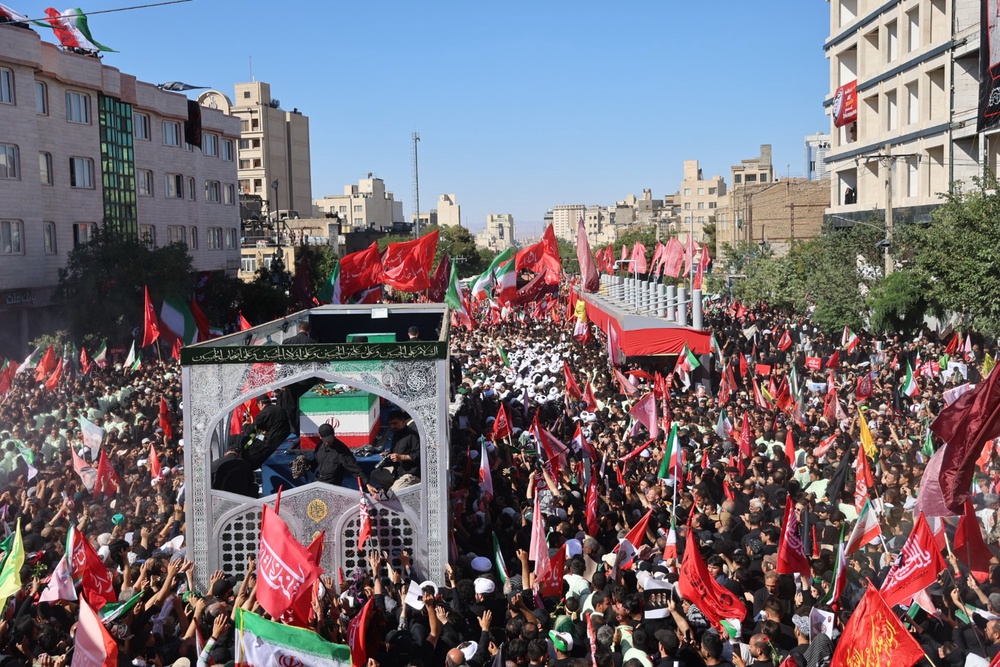 A truck carrying the coffin of the late Iranian supreme leader Ayatollah Ali Khamenei moves through a a street in Mashhad, north-eastern Iran (Mohammad Hasan Salavati/AP) (AP)