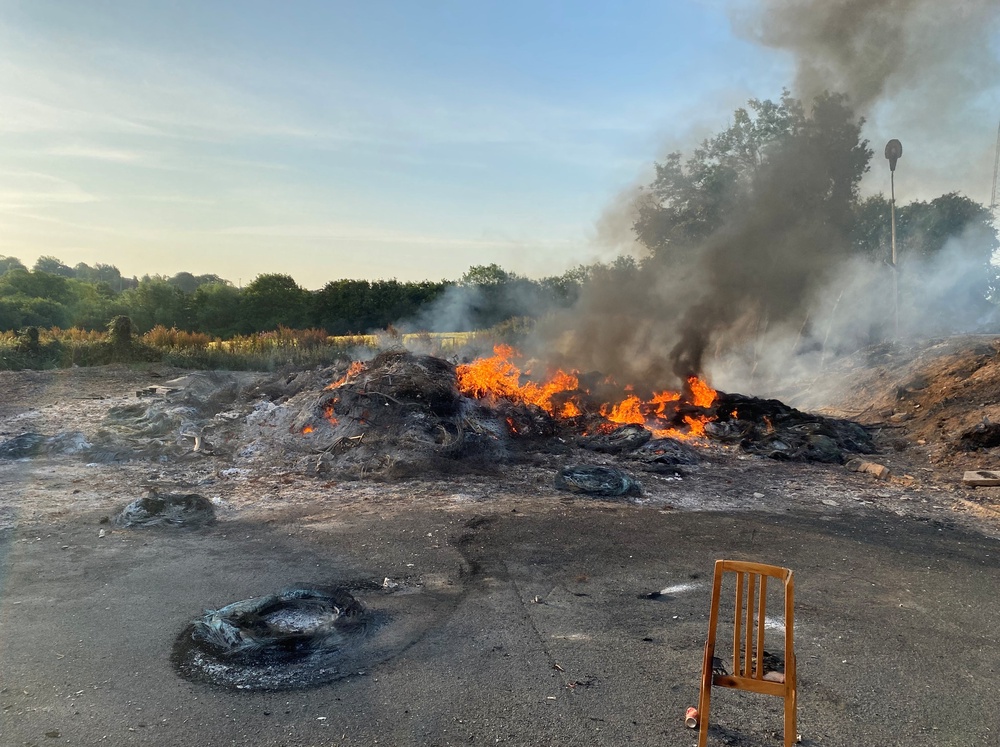 The bonfire was lit before the display could be removed (Jonathan McCambridge/PA) (PA Wire)