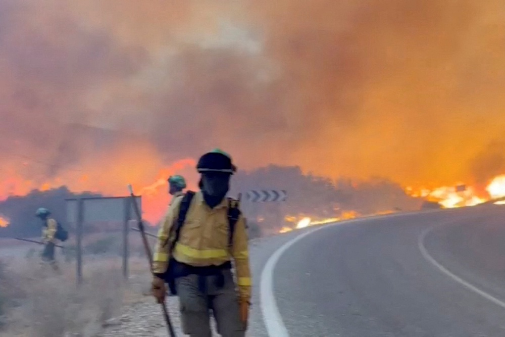 More than 150 firefighters have been working to bring the blaze under control (Reuters)