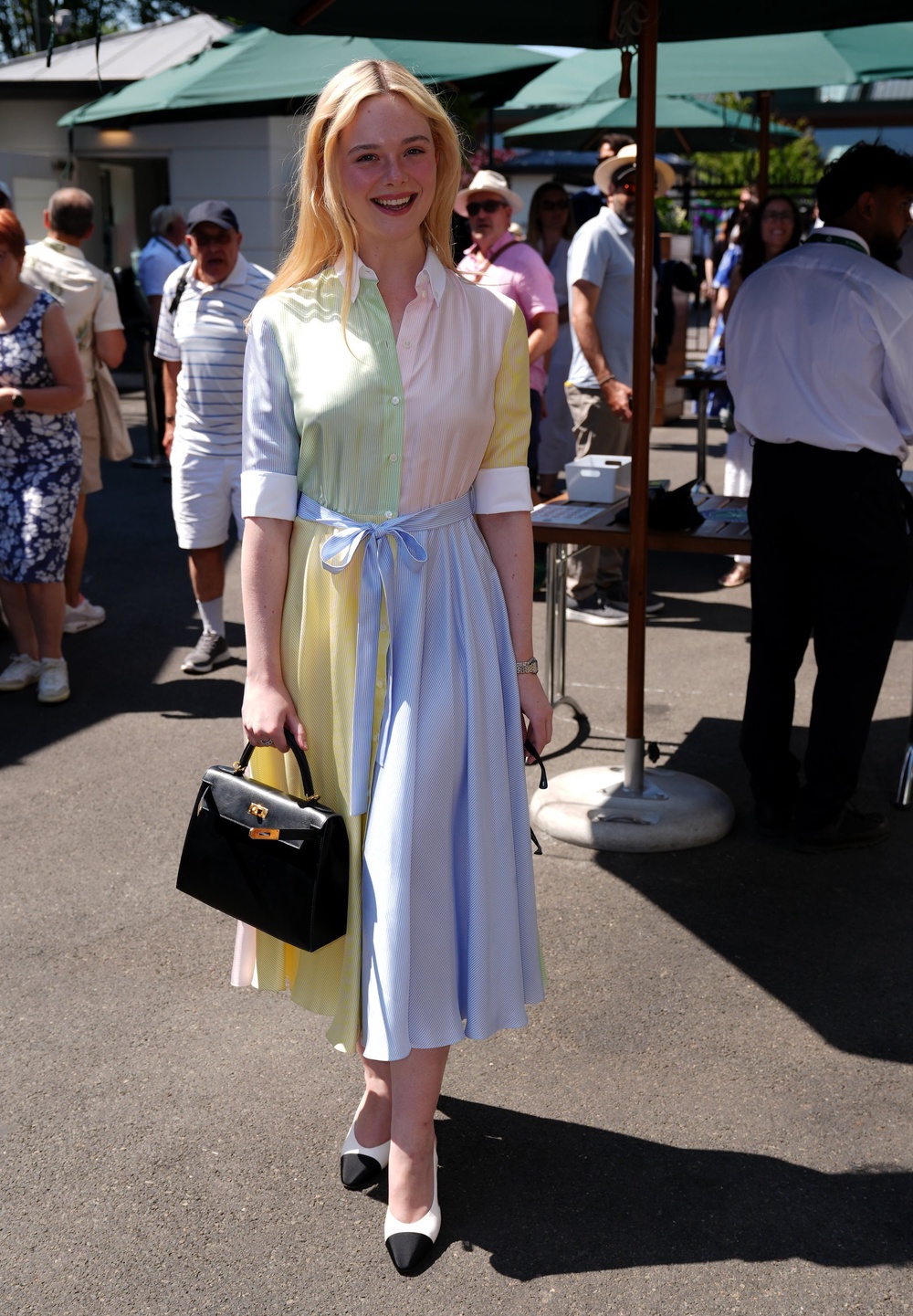 Elle Fanning wore a pastel colour-blocked dress to Wimbledon (PA)