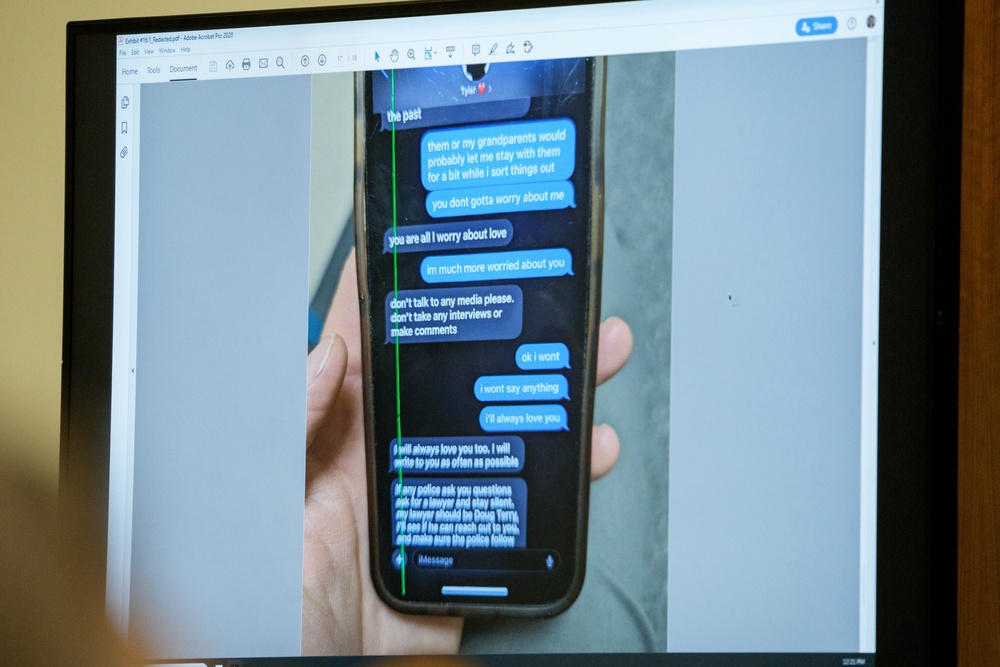 A photograph which prosecutors say shows a text message exchange between Tyler Robinson and Robinson's roommate and romantic partner Lance Twiggs (Getty)