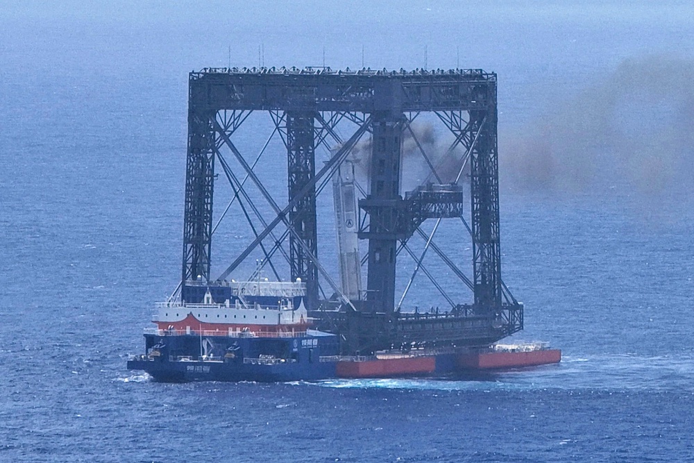 Drone photo shows the successful capture of the returned first stage of Long March-10B (AP)