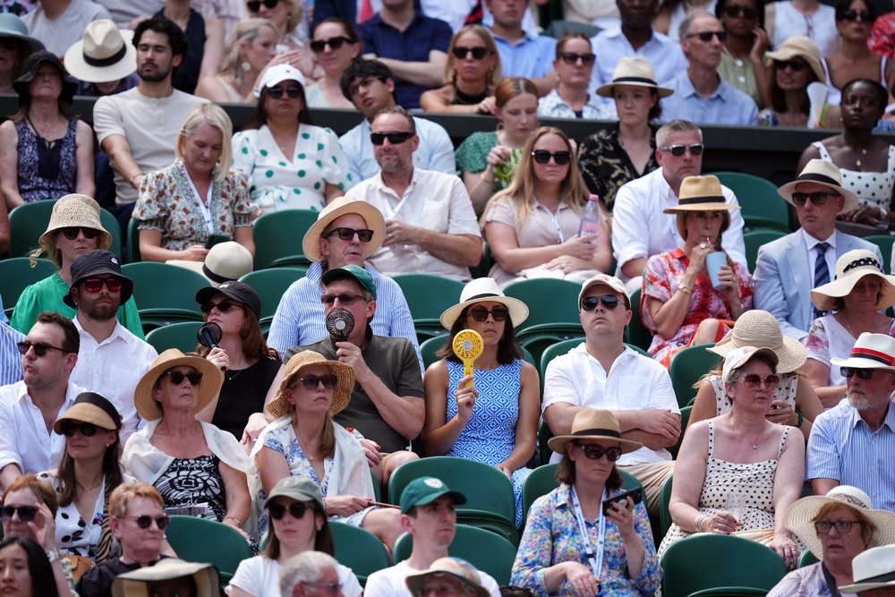 Fans at Wimbledon face another day of hot temperatures (PA) (PA Wire)