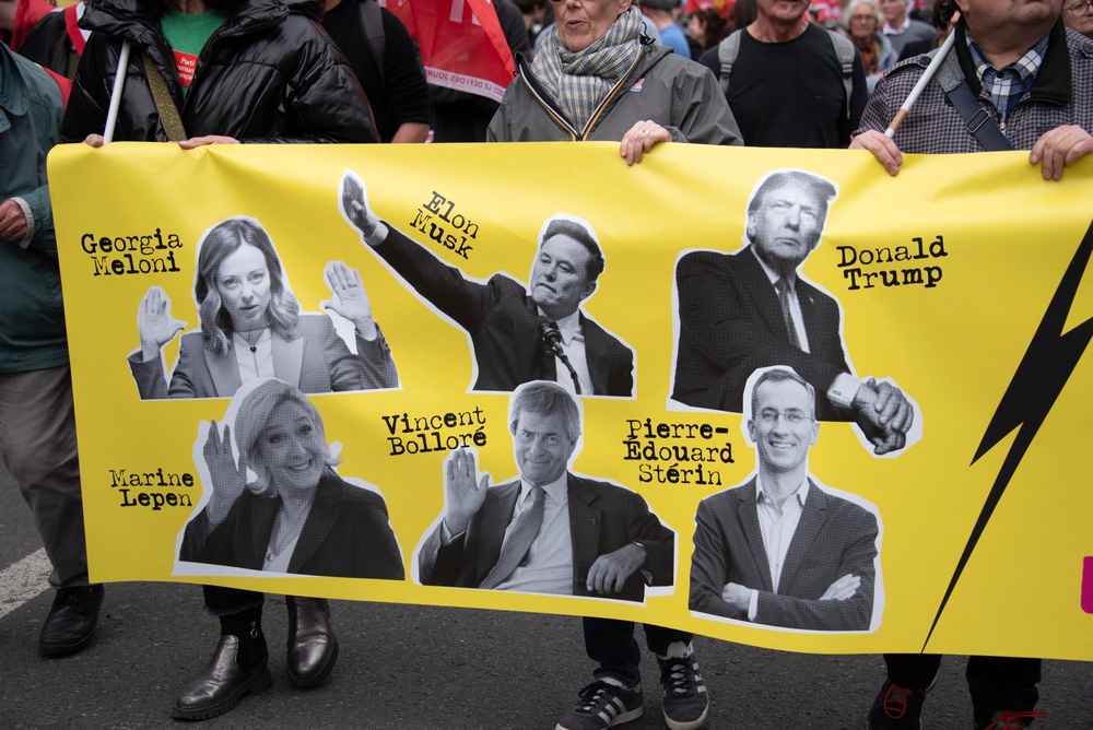 A poster with the images of Elon Musk, Georgia Meloni, Donald Trump, Marine Le Pen, Vincent Bollore, Pierre Edouard Sterin during a demonstration in Paris on March 22, 2025, as part of the international day against racism and fascism (AFP/Getty)