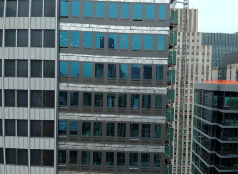 The buckling occurred on the 21st floor of the newer building; temporary supports are now in place as officials investigate (Reuters)