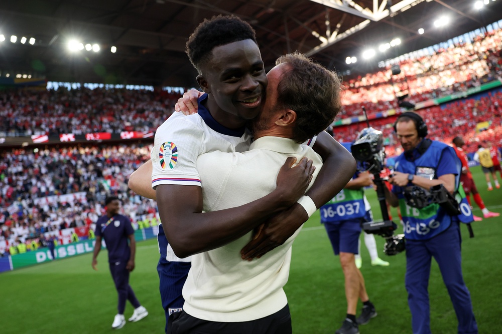 Gareth Southgate embraces Bukayo Saka after England beat Switzerland in the Euro 2024 quarter-finals (Getty)