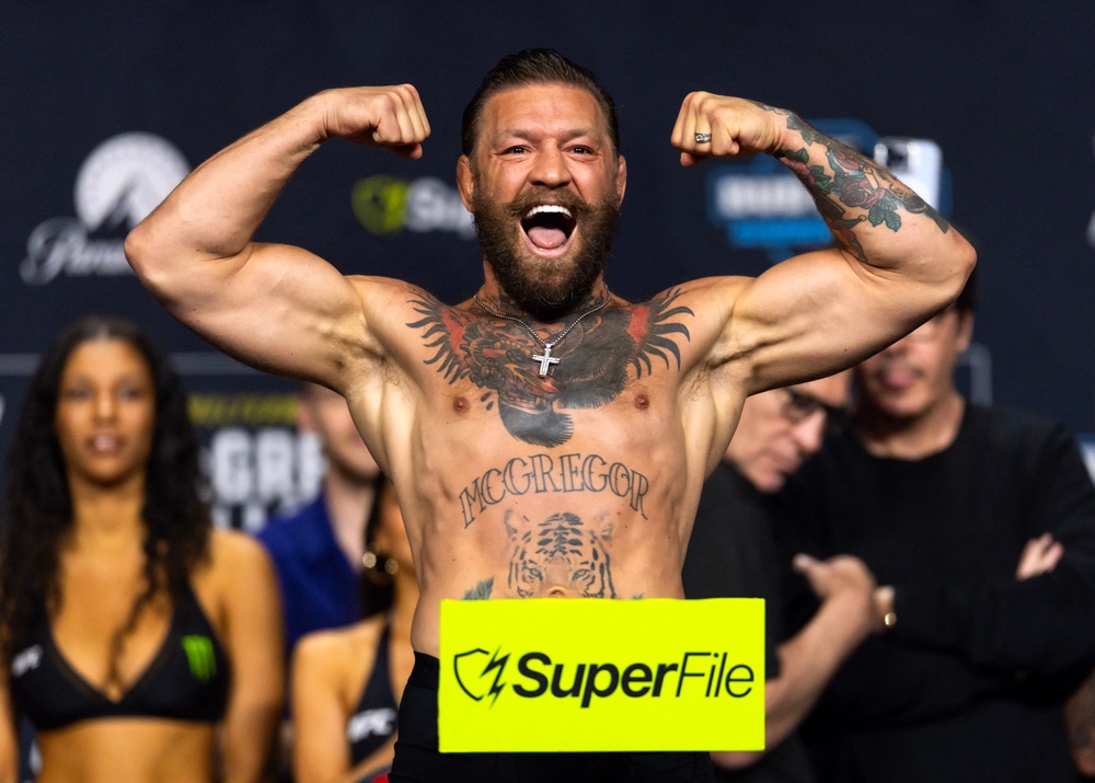 Conor McGregor reacts during weigh ins for UFC 329 (Reuters)