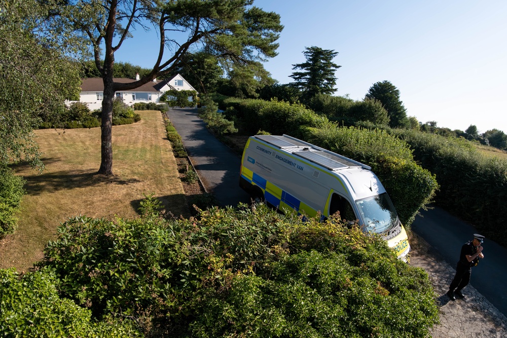 A police officer stands outside the house of Ann Widdecombe in Haytor on Saturday (Getty)