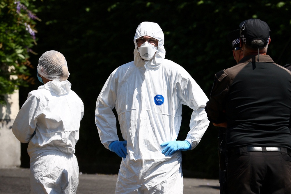 Forensics teams continued to work through Saturday at the home of Miss Widdecombe (Reuters)
