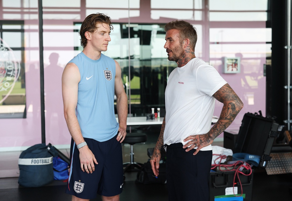 Former England player Sir David Beckham speaks to Anthony Gordon (Getty)