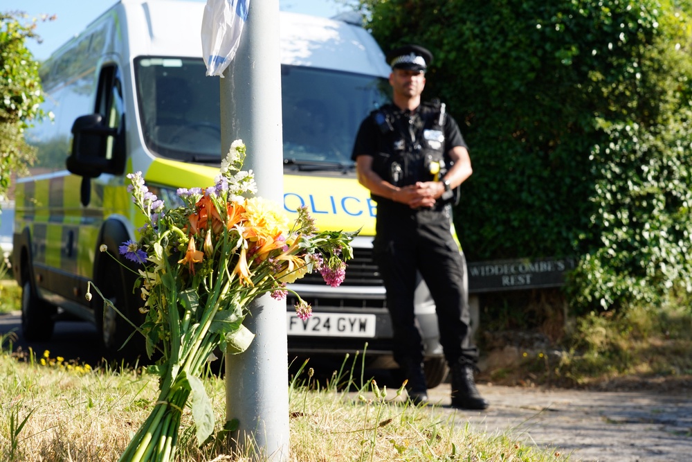 Flowers were left outside the home in Haytor in Dartmoor (PA Wire)