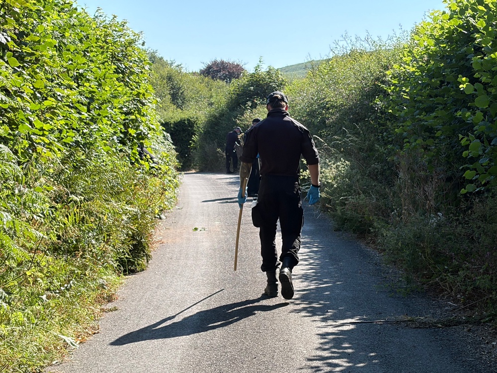 Police searching the lanes around Ann Widdecombe’s house in Haytor Vale (Jacqui Merrington)
