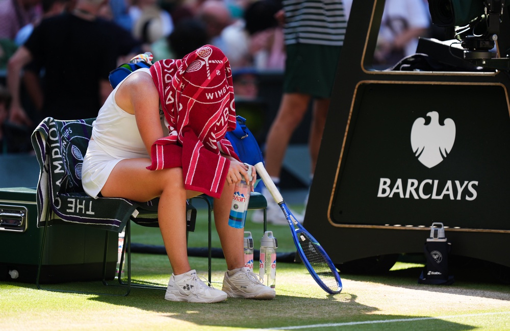 Linda Noskova sits with a towel over her head (Mike Egerton/PA) (PA Wire)
