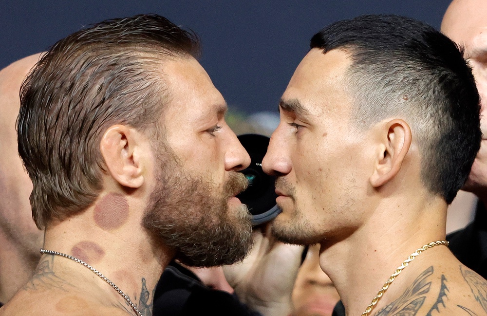 Conor McGregor (left) and Max Holloway face off (AP)