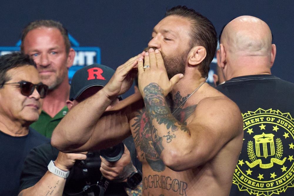 Conor McGregor reacts during a ceremonial weigh-in for UFC 329 (AP)