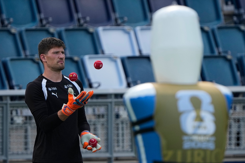 Switzerland goalkeeper Gregor Kobel juggles during training (AP)