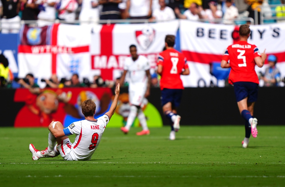 Harry Kane was brought down in the build-up to Norway's opener (PA)