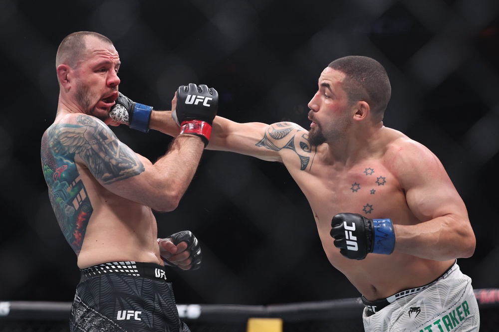 Robert Whittaker (right) appeared to injure Nikita Krylov’s jaw in the TKO finish (Getty)
