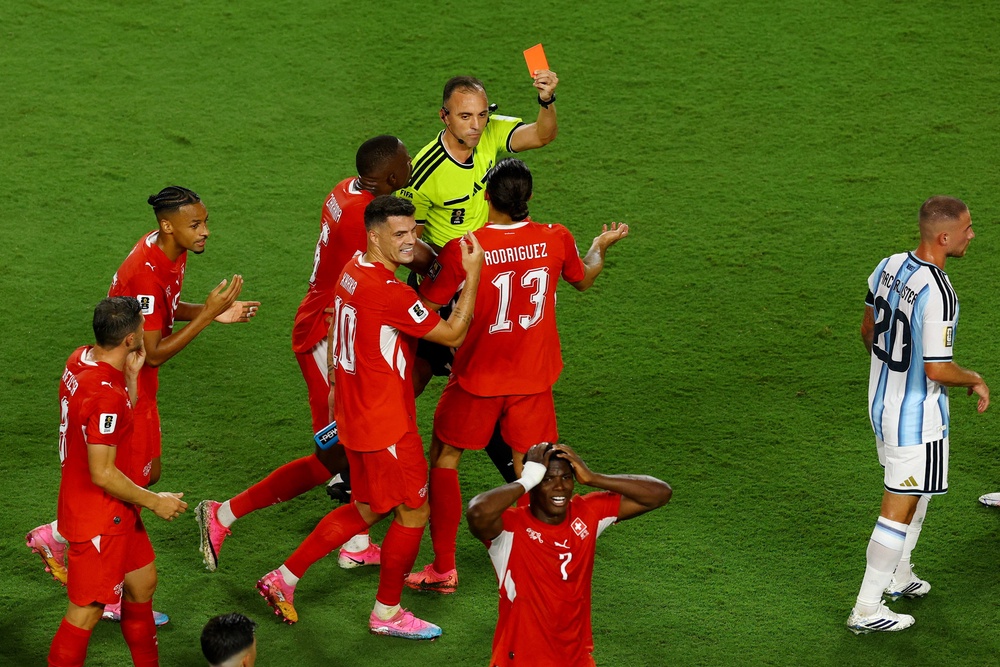 Switzerland's Breel Embolo is shown a red card by referee Joao Pinheiro after a VAR review (Reuters)