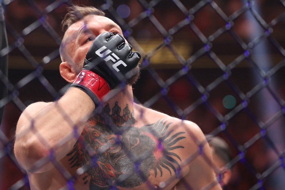 A dejected Conor McGregor after sustaining a new injury (Getty)